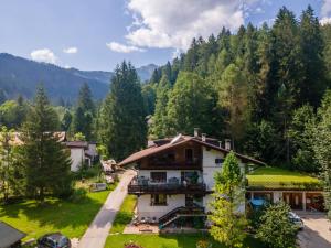 an aerial view of a house in the mountains at Lodge Auta in Falcade