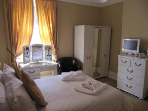 Letto o letti in una camera di The Shirley