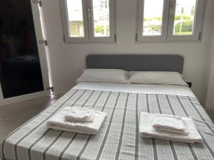Ein Bett oder Betten in einem Zimmer der Unterkunft Corridoni33 - Immobili e Soluzioni Rent