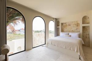 Ένα ή περισσότερα κρεβάτια σε δωμάτιο στο Villa Sawa Great Location , Pererenan by OriVista