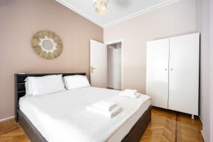 Postel nebo postele na pokoji v ubytování GK Niki by GK Properties