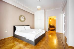 Postel nebo postele na pokoji v ubytování GK Niki by GK Properties