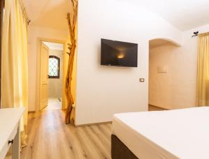 TV a/nebo společenská místnost v ubytování La Jacia Hotel & Resort