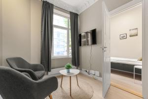 Μια τηλεόραση ή/και κέντρο ψυχαγωγίας στο Forenom Serviced Apartments Majorstuen