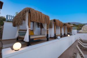 a row of beds on the roof of a villa at Hamarat Otel in Kaş