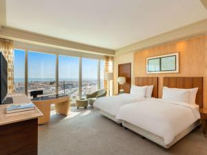 Postel nebo postele na pokoji v ubytování Mövenpick Hotel Al Khobar
