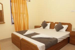 Postel nebo postele na pokoji v ubytování Vinayak Guest House + 19 fotografií