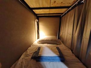 Кровать или кровати в номере ラッコ ゲストハウス 海獭青旅 Sea Otter Guest House