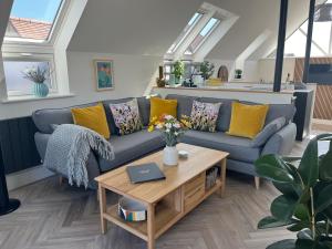 a living room with a couch and a coffee table at The Pines Hotel in Swanage