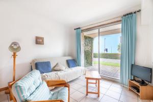 Televízia a/alebo spoločenská miestnosť v ubytovaní Vue mer - Emplacement exceptionnel