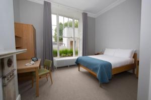 เตียงในห้องที่ Trinity College - Campus Accommodation
