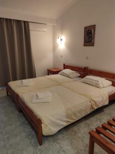Postel nebo postele na pokoji v ubytování Aeolos Hotel + 15 fotografií