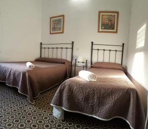 Una cama o camas en una habitación de Pensión Riosol