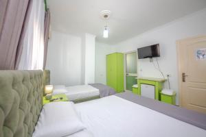 Postel nebo postele na pokoji v ubytování Hotel 3A