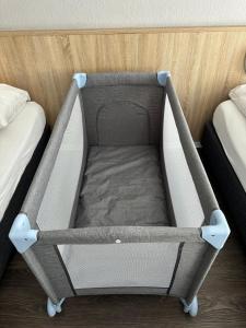 a small bed in a room with two beds at Hotel Kieler Hof am Hauptbahnhof - Hamburg Central Station in Hamburg