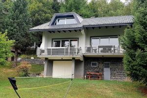 a house with a yard with a house at WOLF'S PLANE Luxury Isolated Mountain House for Digital Nomads in Fojnica
