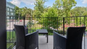Balkon lub taras w obiekcie Rakowicka Podkowa City Center near the train station by Sun & Snow