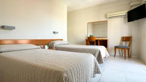 Postel nebo postele na pokoji v ubytování Hotel Safari