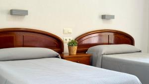 Postel nebo postele na pokoji v ubytování Hotel Safari