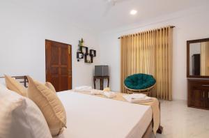 Giường trong phòng chung tại Tranquil Escape Hikkaduwa