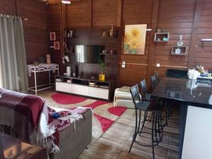 a living room with a couch and a table at Casa da Bela in Pomerode