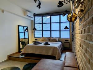 Ένα ή περισσότερα κρεβάτια σε δωμάτιο στο City Plus by CityBee +33 φωτογραφίες