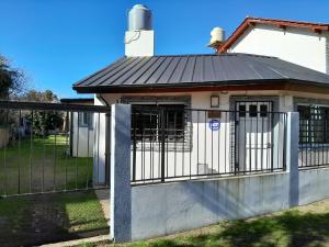 a gate in front of a house at La lechon in Santa Teresita