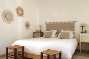 Postel nebo postele na pokoji v ubytování La maison des vendangeurs