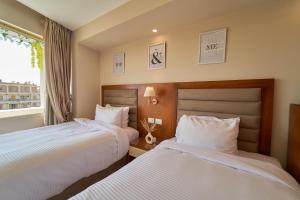 Voodi või voodid majutusasutuse prestige pyramids INN toas