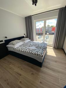 Postel nebo postele na pokoji v ubytování Baltic Stay