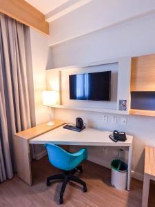 Stay Inn Santos Sua acomodação com cara de Hotel的电视和/或娱乐中心