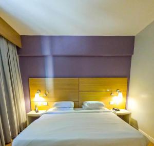 Stay Inn Santos Sua acomodação com cara de Hotel客房内的一张或多张床位