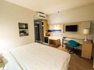 Stay Inn Santos Sua acomodação com cara de Hotel客房内的一张或多张床位
