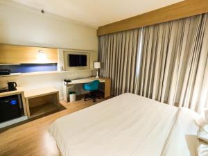Stay Inn Santos Sua acomodação com cara de Hotel客房内的一张或多张床位