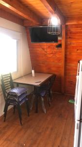 a dining room with a table and two chairs at Cabañas Hakuna Matata in San Blás