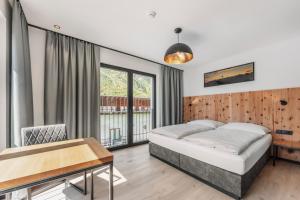 Posteľ alebo postele v izbe v ubytovaní ΛLPSTERN - Silvretta Card Premium Betrieb