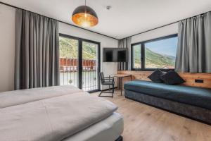 Posteľ alebo postele v izbe v ubytovaní ΛLPSTERN - Silvretta Card Premium Betrieb