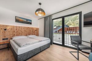 Posteľ alebo postele v izbe v ubytovaní ΛLPSTERN - Silvretta Card Premium Betrieb