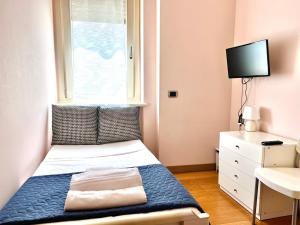 Postel nebo postele na pokoji v ubytování Bergamoinhouse airport