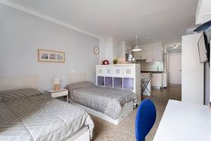 Łóżko lub łóżka w pokoju w obiekcie Luminoso apartamento en la Plaza del Charco