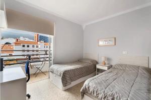 Łóżko lub łóżka w pokoju w obiekcie Luminoso apartamento en la Plaza del Charco