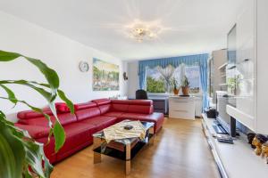 Posezení v ubytování Helle, ruhige Dachwohnung