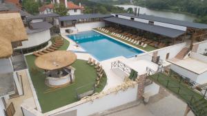 an aerial view of a hotel with a swimming pool at Woodland Resort in Kragujevac