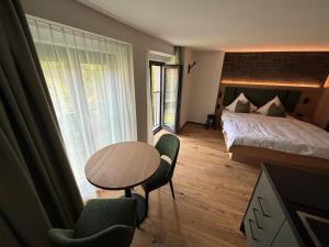 Appart Hotel Pitschonia Self Check-In客房内的一张或多张床位