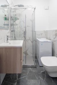 a bathroom with a shower and a toilet and a sink at E&J Mare e Relax in Sanremo