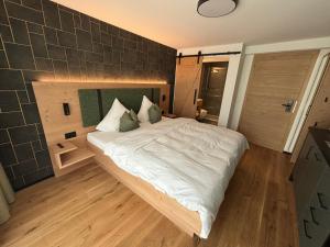 Appart Hotel Pitschonia Self Check-In客房内的一张或多张床位