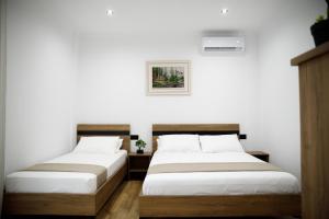 Postel nebo postele na pokoji v ubytování Bliss Hotel
