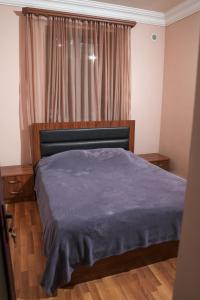 Ένα ή περισσότερα κρεβάτια σε δωμάτιο στο TN Guest House