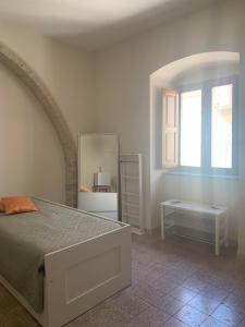 A bed or beds in a room at Affittacamere La Torre