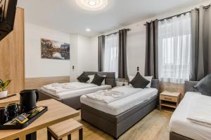 Postel nebo postele na pokoji v ubytování Hotel Montenegro